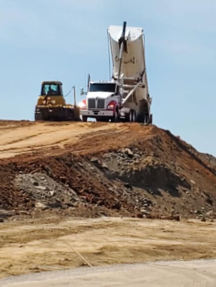 Yocham truck delivering material
